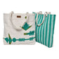 The image shows two tote bags made of natural-colored fabric. One bag features a geometric design with green shapes, including arrows and triangles, while the other bag has a striped pattern in green and white. Both bags have sturdy rope handles.