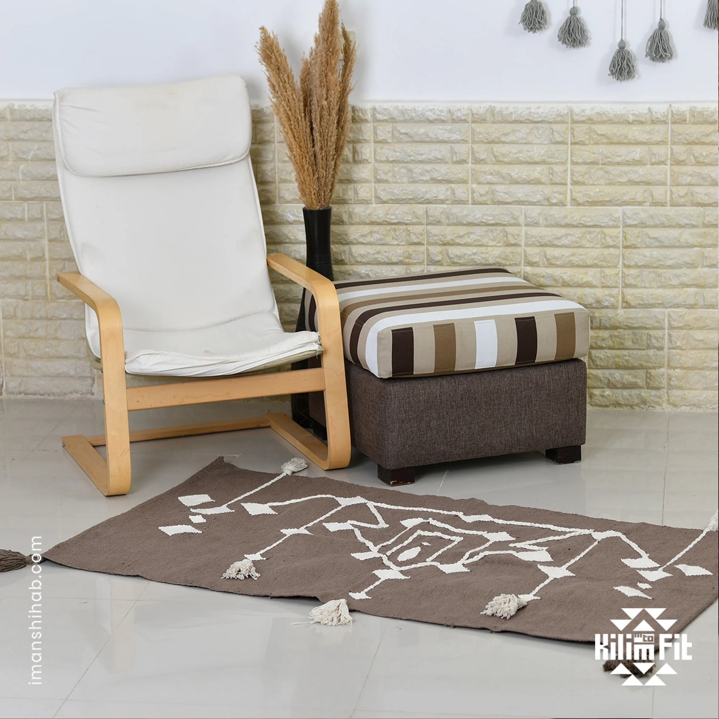 This 1 x 1.5 meter rug features a bold, Brown background and a striking white geometric pattern that consists of interconnected diamond shapes, creating a visually engaging composition. The edges are adorned with fringed tassels made of the same material, contributing to the traditional and artisanal aesthetic.