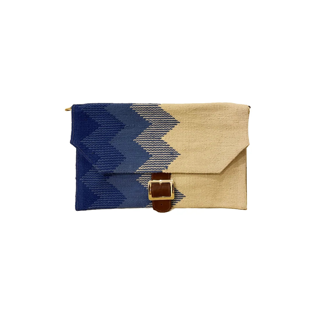 "A stylish, folded woven clutch featuring a geometric zigzag pattern in shades of beige and blue. The clutch is secured with a leather strap and buckle, showcasing a modern and artistic design."