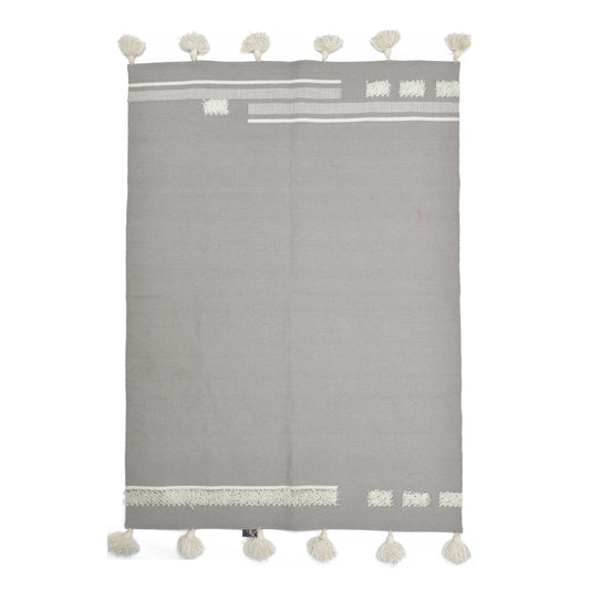 A large, rectangular rug (1.5 x 2 meters) in a light gray color is displayed against a white background. The rug has a slightly textured, woven appearance. A border of off-white geometric patterns and tassels runs along the top and bottom edges. The pattern includes horizontal stripes and small rectangular shapes, creating a simple yet elegant design.